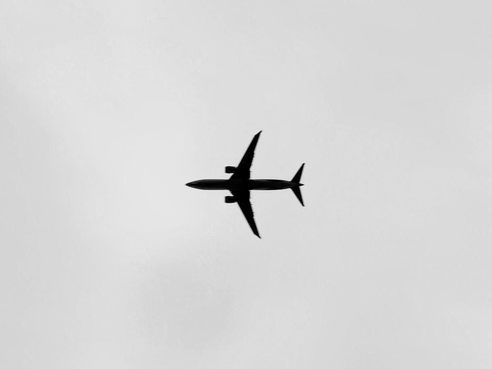 Photograph of an aeroplane flying to Heathrow Airport captured in Windsor, United Kingdom.